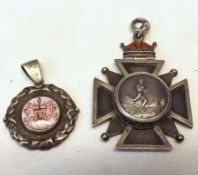 A white metal Maltese Cross Pendant with enamelled crown top, the centre with circular
