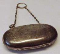 A George V Evening Bag, or oval shape with ribbon tie and garland engraved decoration, fitted