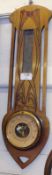 A small Arts and Crafts style Fruitwood Cased Wall Barometer of rectangular form, (Thermometer