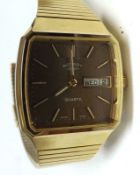 A Gents 1970s cased Rotary Gold plated Wristwatch, Gold batons to a brown metallic shaped square
