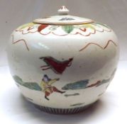 A late 19th Century Chinese large covered globular Jar, decorated in iron red and famille verte