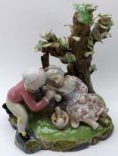 A European Group of children resting beneath a tree, painted in colours throughout (losses), 8” high