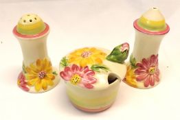 A Clarice Cliff “My Garden” Three Piece Cruet comprising a Salt and Pepperette of waisted form and a