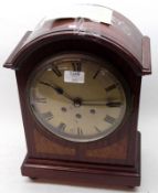An Edwardian Mahogany Mantel Clock with domed top, circular white dial with black Roman chapter ring