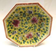 A Chinese Octagonal Plate, the centre painted in underglaze blue, famille verte and rose with