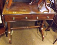 A Reproduction Mahogany Regency style Sofa Table, of rectangular form, each end fitted with a drop
