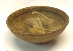 A Jizhou Bowl of tapering circular form, the centre decorated with an unusual motif (rim chips etc),