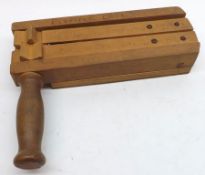 A Vintage Wooden Football Rattle, 10 ½” long