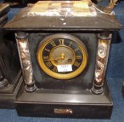 A late 19th/early 20th Century Black Marble Mantel Clock with veined pilasters, strike on bell