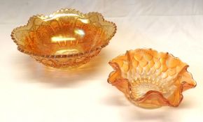 Two Carnival Glass Bowls, one of rosette form and the other with a serrated rim, 6” and 8” diameter