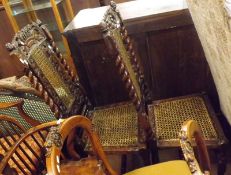 A pair of 17th Century Oak Dining Chairs, the heavily carved backs with barley twist supports to a