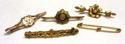 A group of five assorted late 19th/early 20th Century Bar Brooches including a 9ct Gold Military