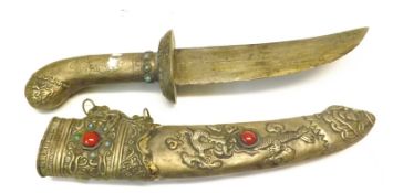 An Oriental or Indian Ceremonial type Dagger, the hilt and scabbard inset with garnet stone detail