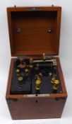 A Vintage Electrotherapy Machine in mahogany case, complete with Siemens Dry Cell Battery, K