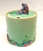 A Clarice Cliff “My Garden” Cylindrical Covered Preserve Pot, plain green glaze body and the lid and