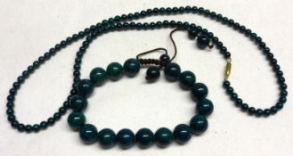 A 20th Century Malachite Bead Necklace, 4 ½ mm diameter; together with a similar Bracelet, 10mm