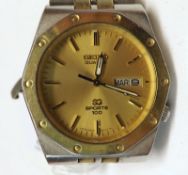 A Gents circa 1980s Seiko Quartz-SQ Sports 100, stainless steel cased Wristwatch with gold batons to