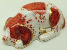 A Royal Crown Derby Paperweight “Puppy”, gilt button, 3 ½” long