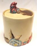 A Clarice Cliff “My Garden” Cylindrical Covered Preserve Pot with plain grey glaze body and the