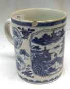 A late 18th Century Chinese Export Tankard, painted in underglaze blue with panels of Chinese