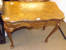 A 20th Century Reproduction Walnut Veneered Card Table, shaped revolving top with brown baize-