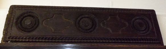 An unusual Carved Oak Plaque of rectangular form, inset with geometric designs and with a moulded