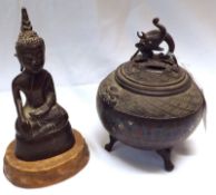 A Chinese Bronze Patinated small Lidded Koro of globular form with a pierced cover, the body with