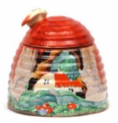 A Clarice Cliff Forest Glen Honeypot of domed form, the lid with a bee finial, black printed Newport