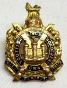 A yellow metal and Enamel “Scottish Kings Border” Military Dress Brooch, 30mm x 20mm, stamped “9ct”