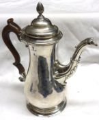 A George III period Coffee Pot of circular baluster form, to a circular foot, acanthus clad spout,