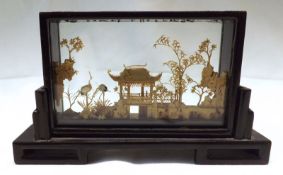 A 20th Century Cork Picture depicting a pagoda, foliage and cranes etc, 6 ½” long