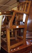 A 19th Century Mendlesham type Stick Back Armchair, with swept arms, to an elm seat raised on a