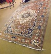 A late 20th Century Caucasian Carpet, central panel of floral lozenges, mainly puce field with