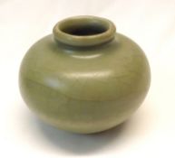 A Song Dynasty Celadon Jarlet of circular baluster form, 2 ¼” high