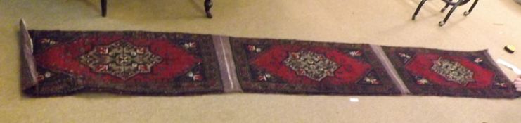 A joined set of three Turkish Mut Prayer Rugs, each with central lozenges, mainly red and dark