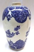 An Oriental Baluster Vase of tapering form, decorated in underglaze blue with sprigs and sprays