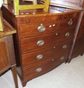 A Victorian Mahogany Bow Front Chest of two short and three full length drawers, with oval brass