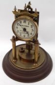 A Brass Anniversary Clock with revolving pendulum, John Elkan, 35 Liverpool Street and 70 Leadenhall