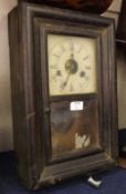 An American Ebonised Cased Wall Clock of rectangular form with moulded edge, Seth Thomas,