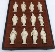 A cased set of bone or ivory Models of the Twelve Apostles, each piece approx 2” high