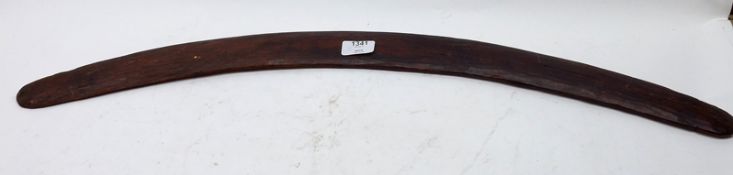 A 20th Century Pine Boomerang or Throwing Club, of usual curved form, 31” long
