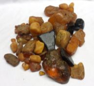 A large bag of unpolished Amber and Jet Pieces, weighing approx 450 gm all in