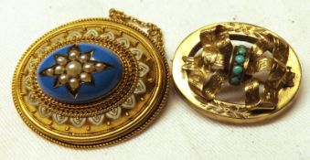 A good Victorian oval Gold Brooch in Etruscan style, the raised blue enamelled centre featuring a