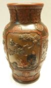 A Chinese Pottery Baluster Vase, of circular form, elaborately moulded with roundels depicting