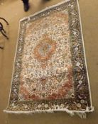 A 20th Century Kashmir Wool/Silk Carpet, triple gull border, central panel of lozenges and
