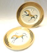 A pair of Clarice Cliff Circular Plates, decorated in colours with a cheval design by John
