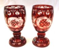 A pair of Bohemian Glass (Czechoslovakian) Goblets, each typically etched with houses, trees and