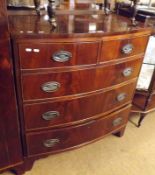 A 19th Century Mahogany Bow Front Chest of two short and three long drawers, with oval brass plate