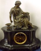 An ornate black Marble large Mantel Clock, crested with a Bronze patinated gilt metal Figure of a