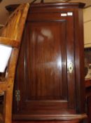 A 19th Century Mahogany Single Door Corner Cabinet, of typical form fitted with brass H hinges and